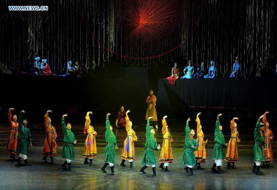 Dancers perform in a folk dance drama in Hohhot, capital city of north China's Inner Mongolia Autonomous Region, June 26, 2015. 