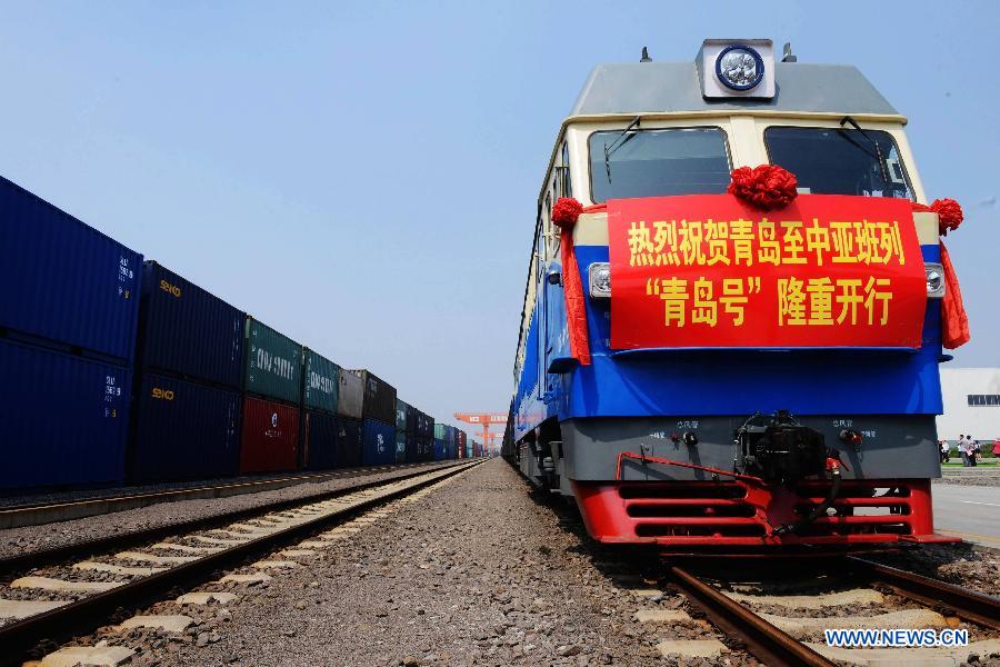 The 'Qingdao' freight train heading to Central Asia sets off from the central station of CRIntermodal in Qingdao, a port city in east China's Shandong Province, July 1, 2015.