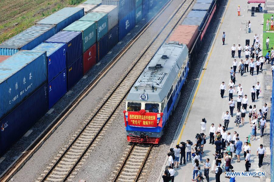 The 'Qingdao' freight train heading to Central Asia sets off from the central station of CRIntermodal in Qingdao, a port city in east China's Shandong Province, July 1, 2015. 