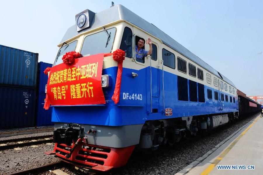 The 'Qingdao' freight train heading to Central Asia sets off from the central station of CRIntermodal in Qingdao, a port city in east China's Shandong Province, July 1, 2015.