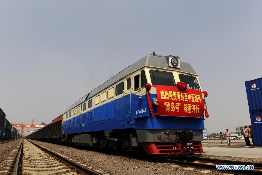 The 'Qingdao' freight train heading to Central Asia sets off from the central station of CRIntermodal in Qingdao, a port city in east China's Shandong Province, July 1, 2015. 