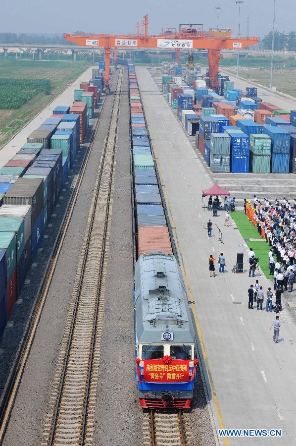 The 'Qingdao' freight train heading to Central Asia sets off from the central station of CRIntermodal in Qingdao, a port city in east China's Shandong Province, July 1, 2015.