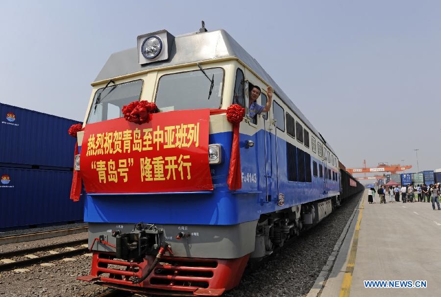 The 'Qingdao' freight train heading to Central Asia sets off from the central station of CRIntermodal in Qingdao, a port city in east China's Shandong Province, July 1, 2015.