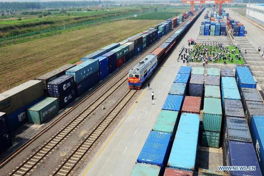 The 'Qingdao' freight train heading to Central Asia sets off from the central station of CRIntermodal in Qingdao, a port city in east China's Shandong Province, July 1, 2015.