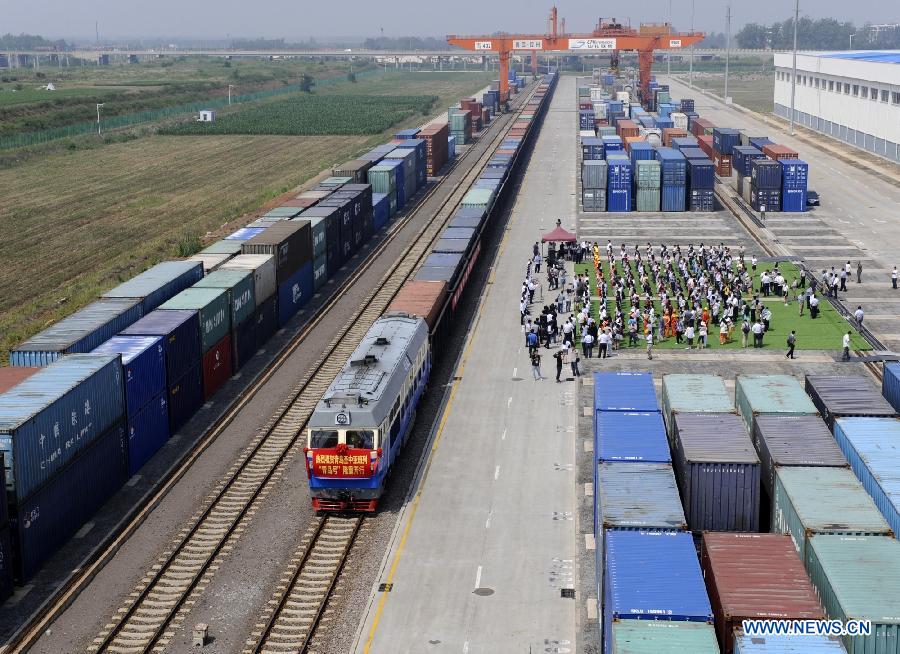 The 'Qingdao' freight train heading to Central Asia sets off from the central station of CRIntermodal in Qingdao, a port city in east China's Shandong Province, July 1, 2015. 