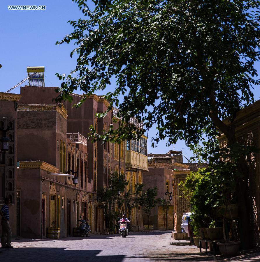 Photo taken on June 7, 2015 shows a street in the old town of the old town of Kax, northwest China's Xinjiang Uygur Autonomous Region. 