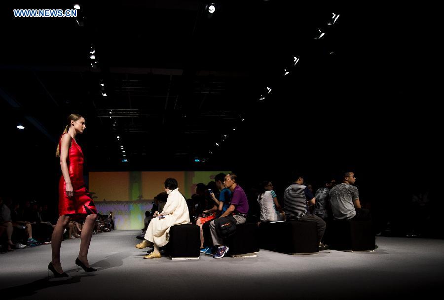 A model shows a creation at the 22nd Hong Kong Fashion Week for Spring/Summer in Hong Kong, south China, July 8, 2015. 