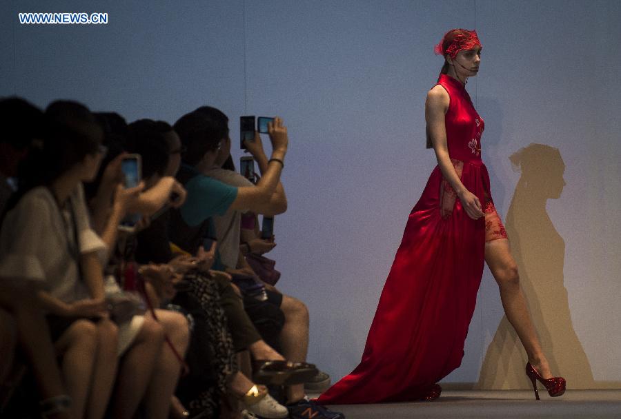 A model shows a creation at the 22nd Hong Kong Fashion Week for Spring/Summer in Hong Kong, south China, July 8, 2015. 