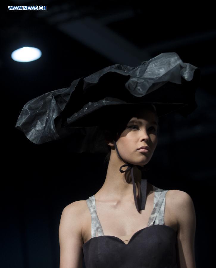 A model shows a creation at the 22nd Hong Kong Fashion Week for Spring/Summer in Hong Kong, south China, July 8, 2015.