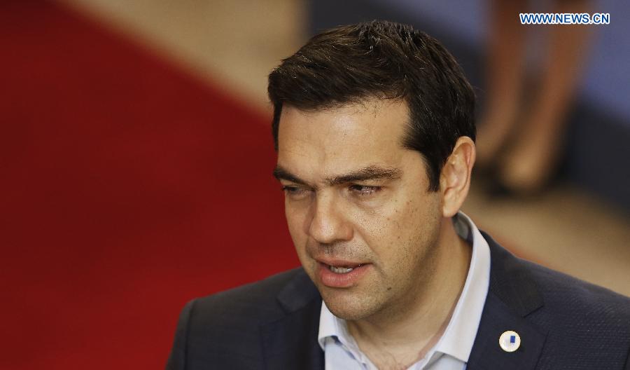 Greek Prime Minister Alexis Tsipras speaks to press after the 17-hour Euro Summit at the EU headquarters in Brussels, Belgium, July 13, 2015.