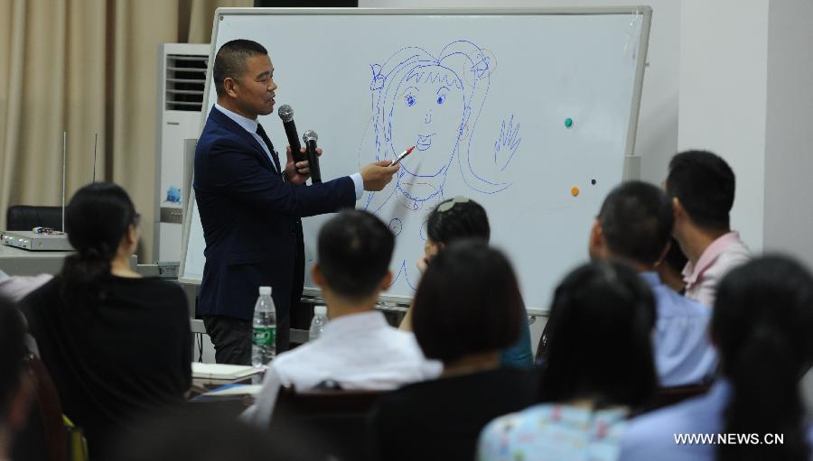 Ma Leijun from UN Women speaks at a training class on anti-domestic violence at the Hunan Police Academy in Changsha, capital of east China's Hunan Province, July 15, 2015.