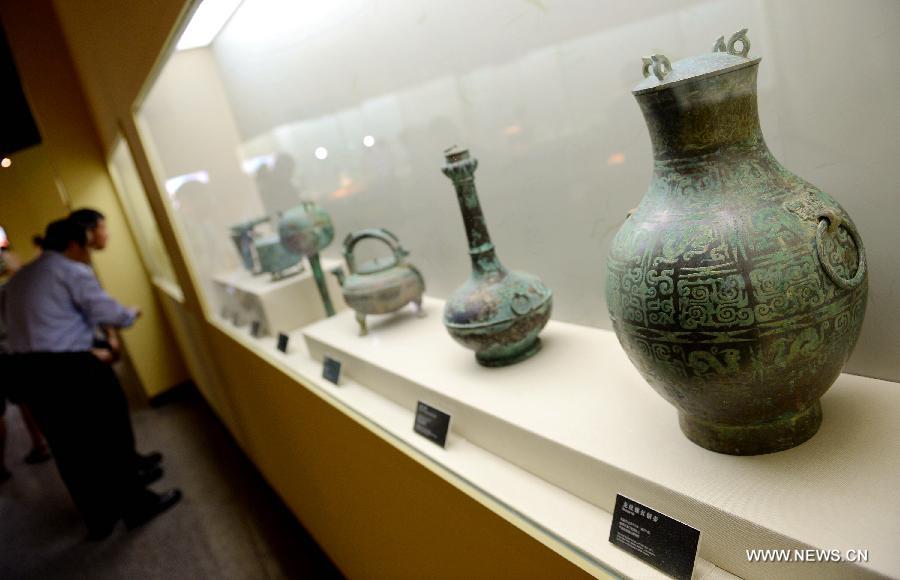 Spectators visit a historic and cultural exhibiton of Qi(1046BC-221BC), an ancient Chinese state during the Zhou Dynasty of ancient China, in Xi'an, capital of northwest China's Shaanxi Province, July 16, 2015. 