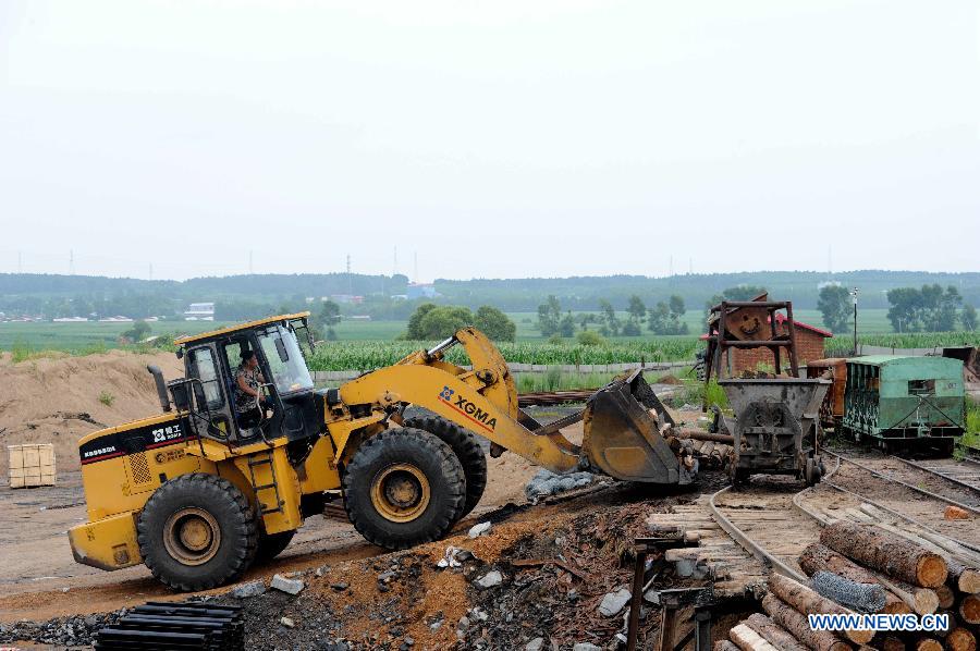 Rescue materials are loaded onto a tramcar at Xuxiang Colliery in Hegang City, northeast China's Heilongjiang Province, July 24, 2015. 