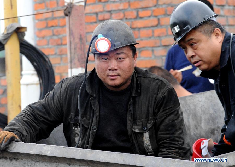 Rescuers prepare to enter the well at Xuxiang Colliery in Hegang City, northeast China's Heilongjiang Province, July 24, 2015. 