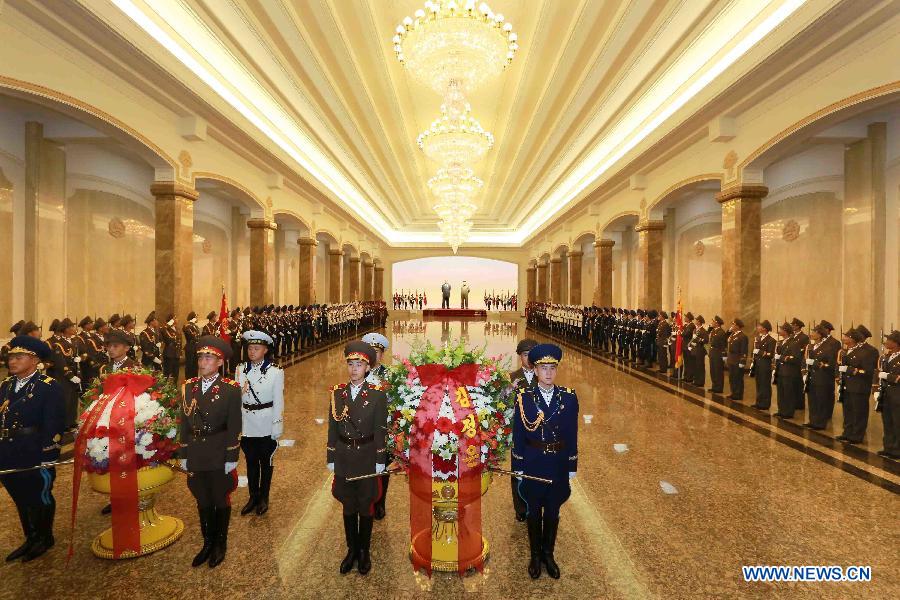 Photo provided by Korean Central News Agency (KCNA) on July 27, 2015 shows top leader of the Democratic People's Republic of Korea (DPRK) Kim Jong Un (unseen) visiting the Kumsusan Palace of the Sun on the occasion of the 62nd anniversary of the victory in the Fatherland Liberation War of the DPRK at 00:00, July 27. The chief of the guard of honor of the Korean People's Army (KPA) Ground, Naval, Air and Anti-Air Forces and the Worker-Peasant Red Guards made a salute towards the statues of late leader Kim Il Sung and Kim Jong Il. Placed at the statues were a floral basket in the name of Kim Jong Un and a floral basket in the name of the KPA. Kim Jong Un, together with other visitors, paid a high tribute to the statues of Kim Il Sung and Kim Jong Il. (Xinhua/KCNA) 