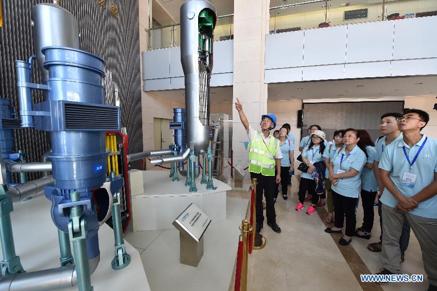 Public representatives and reporters visit an instrument model at Fuqing Nuclear Power Co., Ltd. of China National Nuclear Corporation (CNNC) in Fuqing, southeast China's Fujian Province, July 27, 2015. 