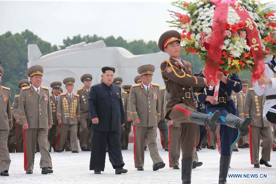 Photo provided by Korean Central News Agency (KCNA) on July 28, 2015 shows top leader of the Democratic People's Republic of Korea (DPRK) Kim Jong Un (C) visiting the Fatherland Liberation War Martyrs Cemetery on the occasion of the 62nd anniversary of the victory in the great Fatherland Liberation War of the DPRK, to pay high tribute to the fallen fighters of the People's Army on July 27, 2015.