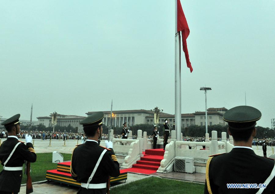 A national flag-raising ceremony is held at the Tian'anmen Square in Beijing, capital of China, Aug. 1, 2015 to celebrate the 88th anniversary of the founding of the Chinese People's Liberation Army, and Beijing and Zhangjiakou's winning the bid for hosting the 2022 Winter Olympics. (Xinhua/Tang Zhaoming) 