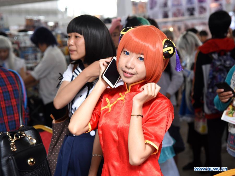 A cosplayer poses for photo during the 2015 Yunnan Cultural Industry Expo in Kunming, capital city of southwest China's Yunnan Province, Aug. 7, 2015. 