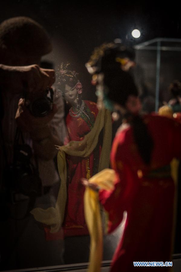 A silk figurine is seen during an exhibition in Beijing, capital of China, Aug. 7, 2015. 