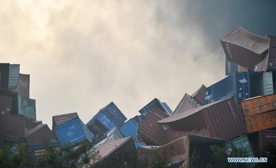 Containers of a construction company collapsed near the explosive site in Binhai New Area of Tianjin, north China, Aug. 13, 2015. 