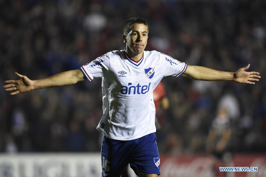 Nacional's Carlos De Pena celebrates scoring during their match on day 1 of the Opening Tournament of the Uruguyan Soccer Championship, against Villa Teresa, held in the Gran Parque Central stadium, in Montevideo, capital of Uruguay, on Aug. 15, 2015.