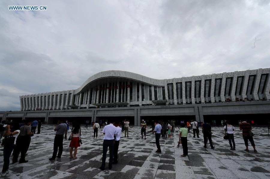 Passengers are seen at the Qiqihar South Railway Station, northeast China's Heilongjiang Province, Aug. 17, 2015.