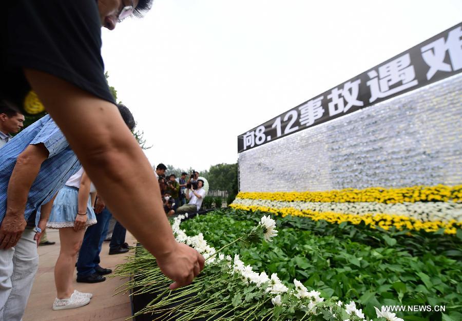  The death toll from last week's massive blasts in Tianjin rose to 114.