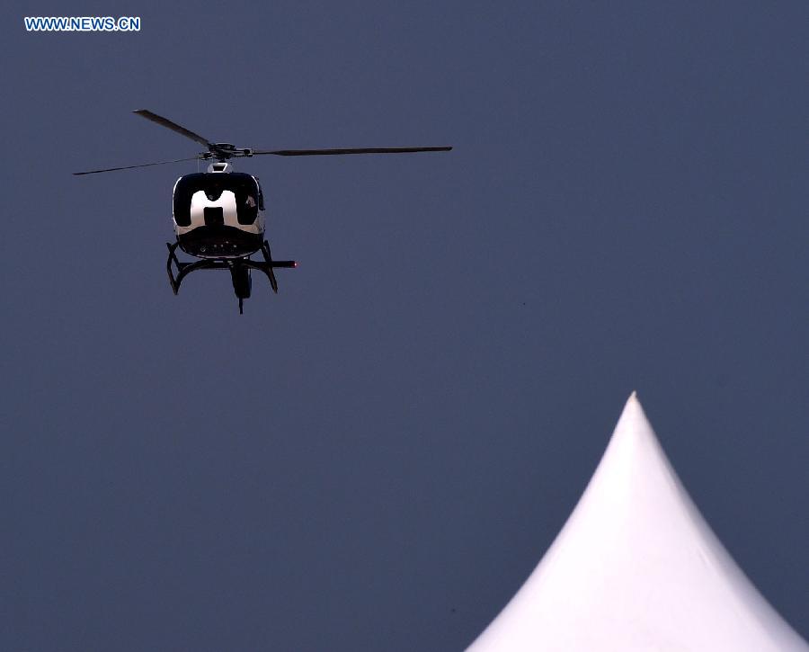 A helicopter shows aerobatics at the opening ceremony of the 2015 Shenyang Faku International Flight Convention, in Faku County of Shenyang, capital of northeast China's Liaoning Province, Aug. 20, 2015.