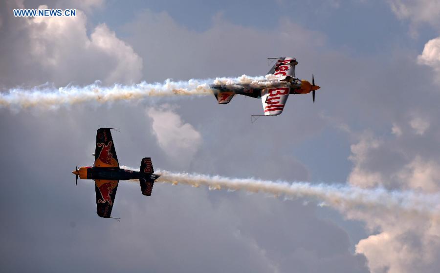 Two aircraft from South Africa's aerobatic team show aerobatics at the 2015 Shenyang Faku International Flight Convention, in Faku County of Shenyang, capital of northeast China's Liaoning Province, Aug. 21, 2015. 