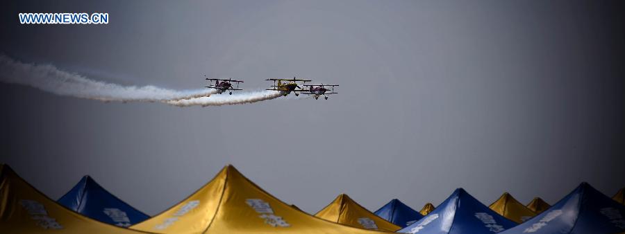 Three aircraft show aerobatics at the 2015 Shenyang Faku International Flight Convention, in Faku County of Shenyang, capital of northeast China's Liaoning Province, Aug. 21, 2015. 