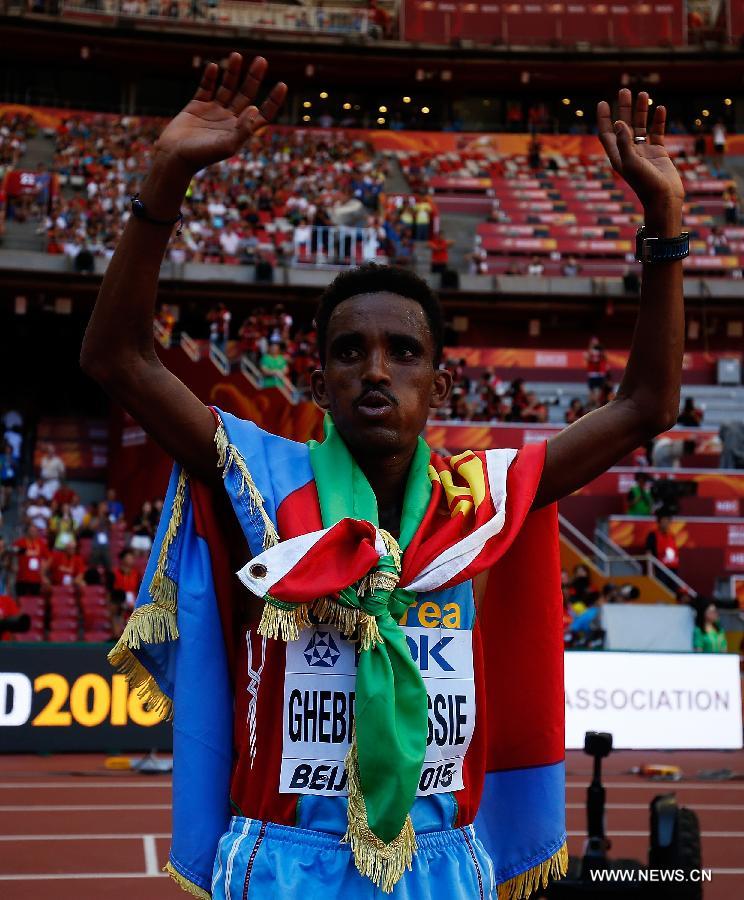 Ghirmay Ghebreslassie of Eritrea celebrates victory after the men's marathon at the 15th IAAF World Athletics Championships 2015 in Beijing, capital of China, on Aug. 22, 2015.