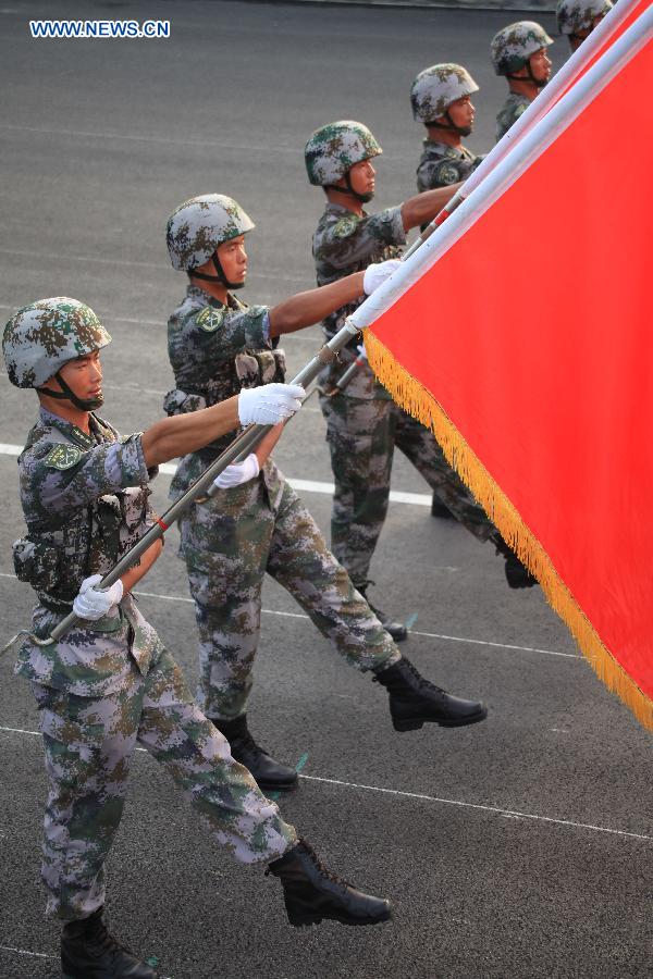 Photo taken on July 23, 2015 shows soldiers participating in training for the Sept. 3 military parade at the parade training base. 