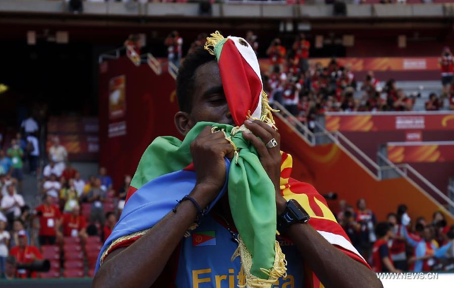 Ghirmay Ghebreslassie of Eritrea celebrates after the men's marathon at the 15th IAAF World Athletics Championships 2015 in Beijing, capital of China, on Aug. 22, 2015. 