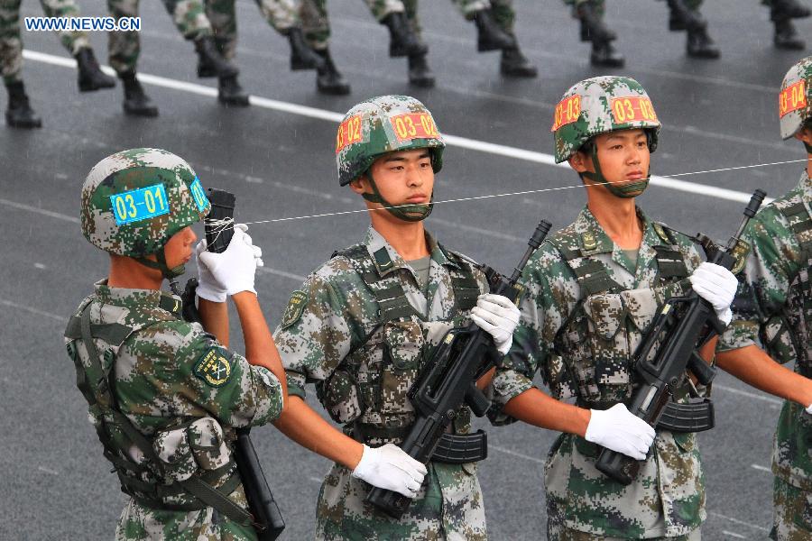 Photo taken on July 23, 2015 shows soldiers participating in training for the Sept. 3 military parade at the parade training base. 