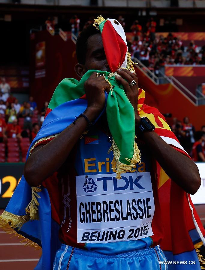 Ghirmay Ghebreslassie of Eritrea celebrates victory after the men's marathon at the 15th IAAF World Athletics Championships 2015 in Beijing, capital of China, on Aug. 22, 2015.