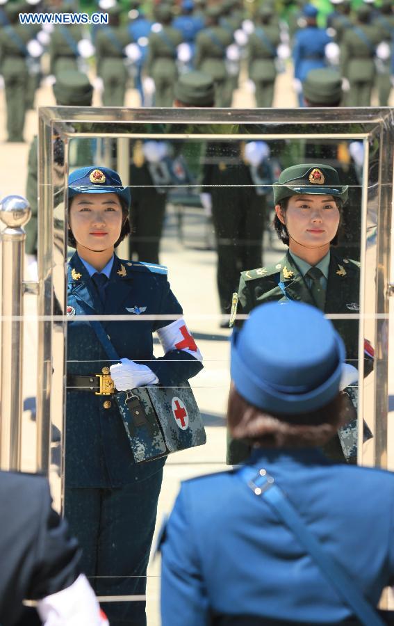 Photo taken on Aug. 4, 2015 shows soldiers participating in training for the Sept. 3 military parade at the parade training base.