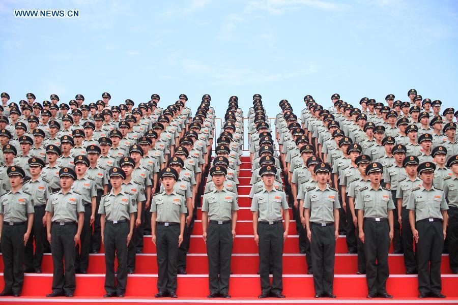 Photo taken on July 23, 2015 shows soldiers of the chorus participating in training for the Sept. 3 military parade at the parade training base in Beijing.