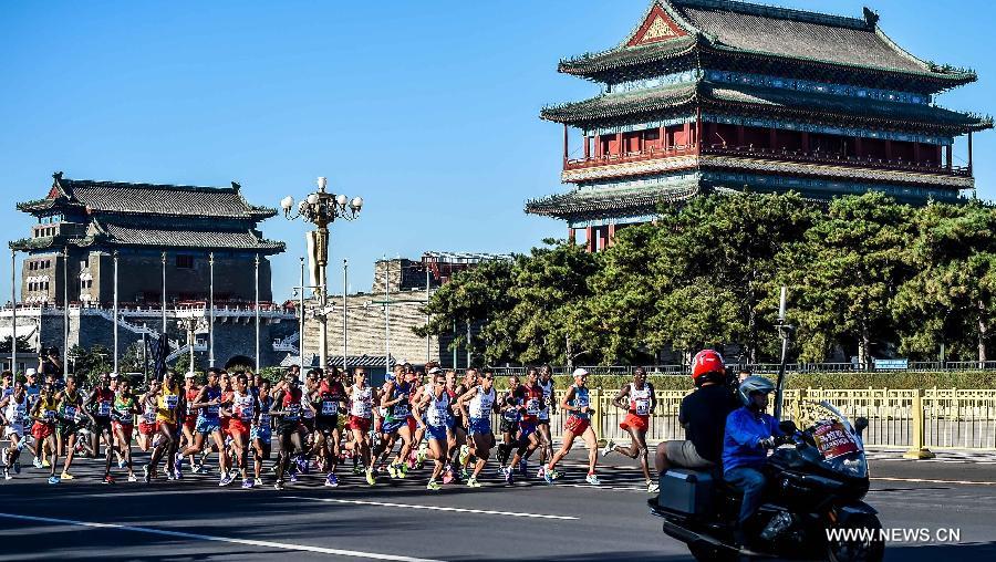 Athletes compete during the men's marathon at the 15th IAAF World Athletics Championships 2015 in Beijing, capital of China, on Aug. 22, 2015. 