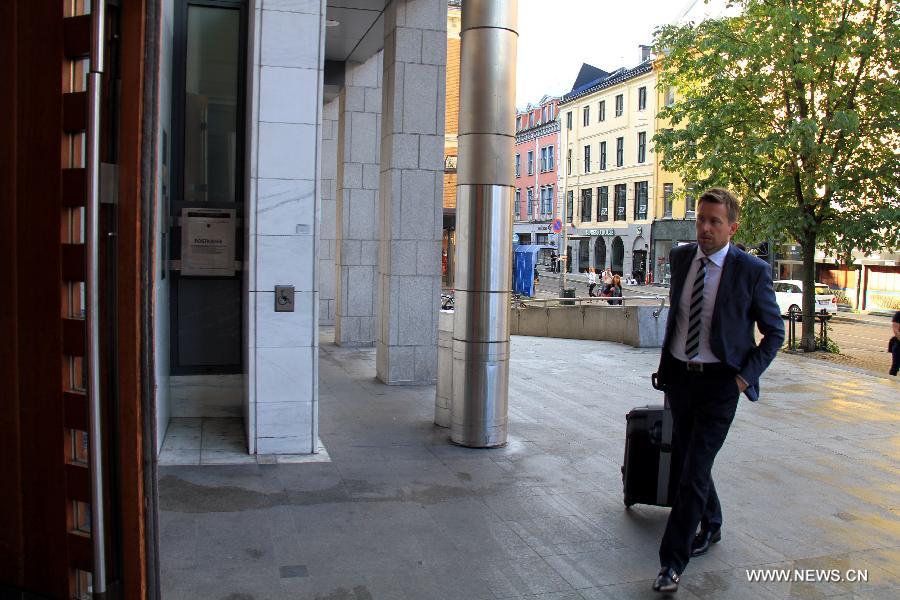 Nils Anders Gronas, the lawyer for an expelled Chinese scholar, enters Oslo District Court in central Oslo, Norway, on Aug. 24, 2015. 