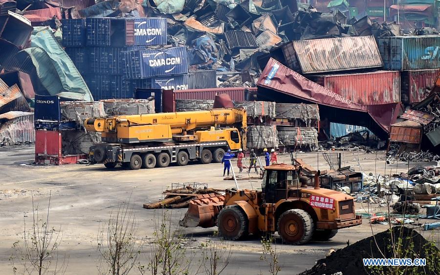 Rescuers work at the core area of explosion site in Tianjin, north China, Aug. 25, 2015.