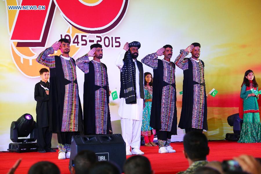 Pakistani officers and soldiers, who will participate in China's military parade on Sept. 3, perform in a party at military parade training base in Beijing, capital of China, Aug. 25, 2015.