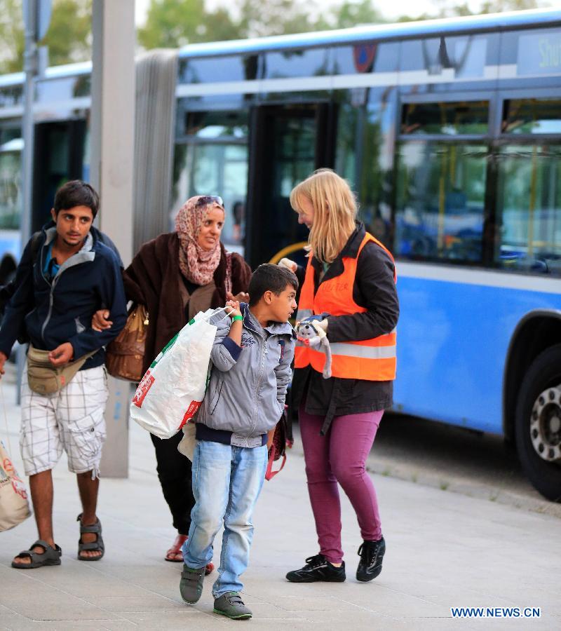 Refugees arrive at a tempopary settlement in Munich, Germany, on Sept. 5, 2015. 