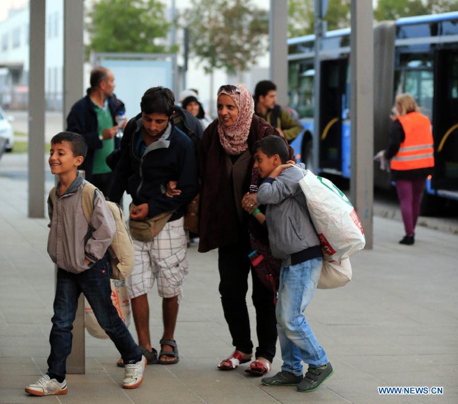 Refugees arrive at a tempopary settlement in Munich, Germany, on Sept. 5, 2015. 