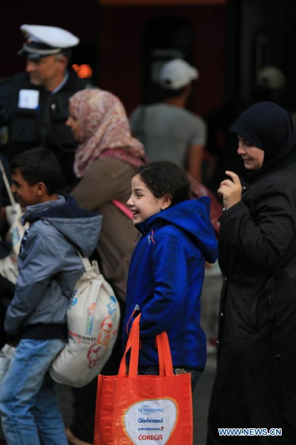 Refugees arrive at a tempopary settlement in Munich, Germany, on Sept. 5, 2015. 