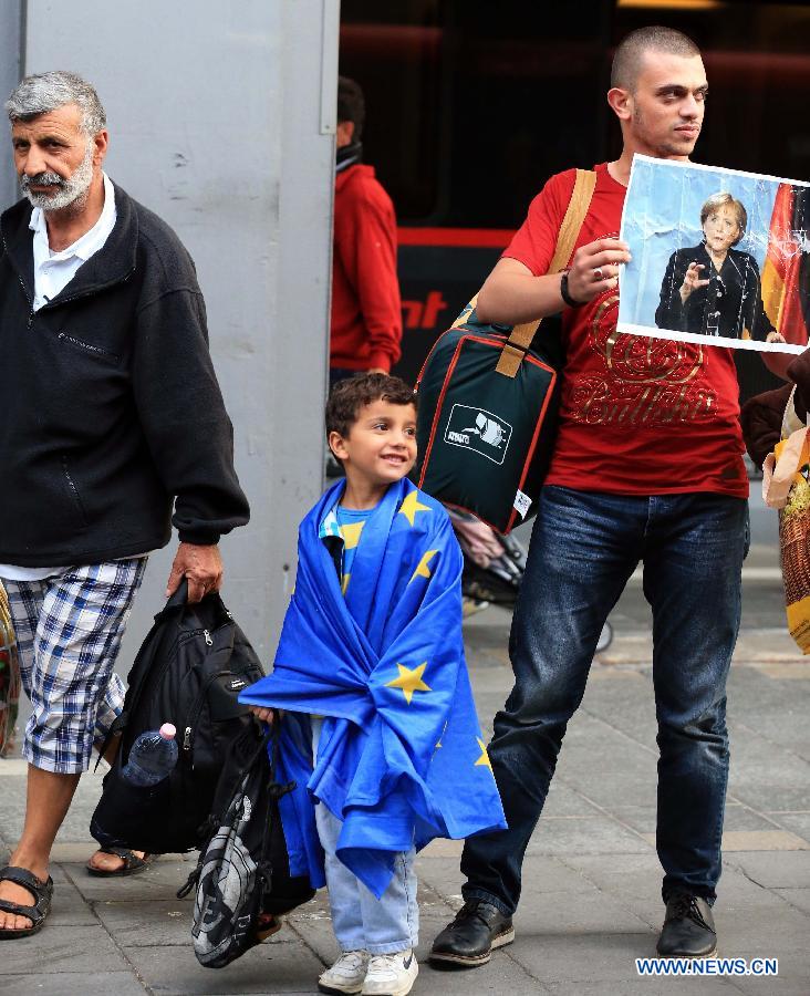 Refugees arrive at a tempopary settlement in Munich, Germany, on Sept. 5, 2015. 