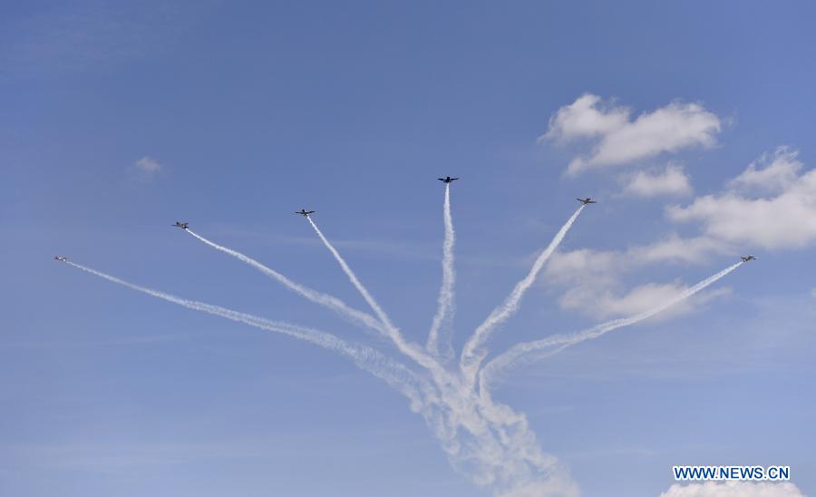 Planes perform aerobatic show during an air show at Andrews Air Base outside Washington D.C. in Maryland, the United States, Sept. 19, 2015.