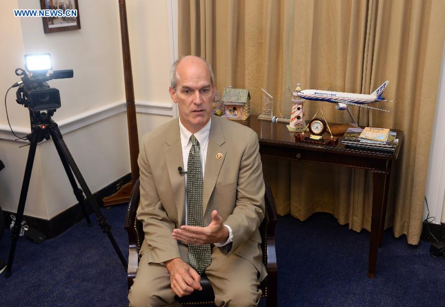 U.S. Congressman Rick Larsen speaks during an interview with Xinhua News Agency on Capitol Hill in Washington, D.C., the United States, Sept. 18, 2015. 