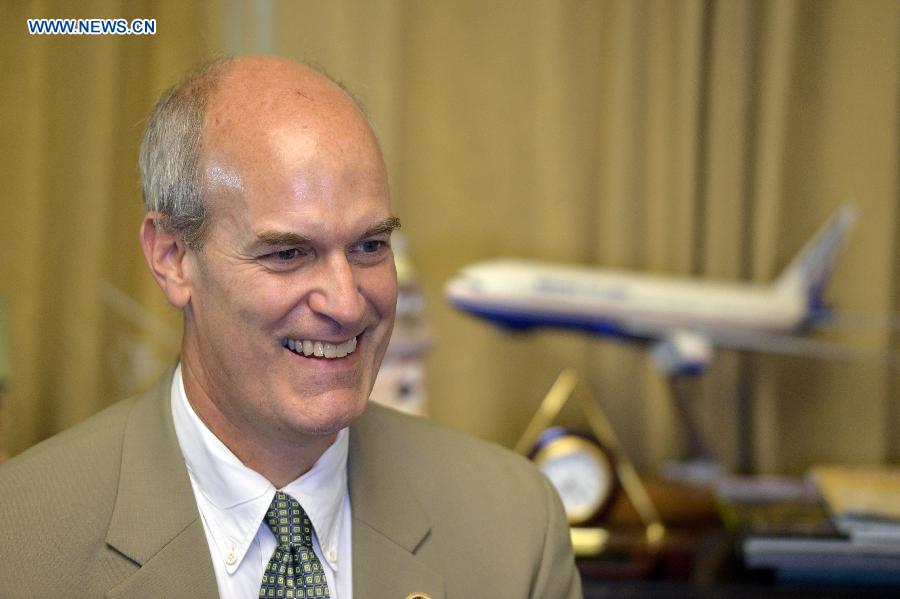 U.S. Congressman Rick Larsen speaks during an interview with Xinhua News Agency on Capitol Hill in Washington, D.C., the United States, Sept. 18, 2015.