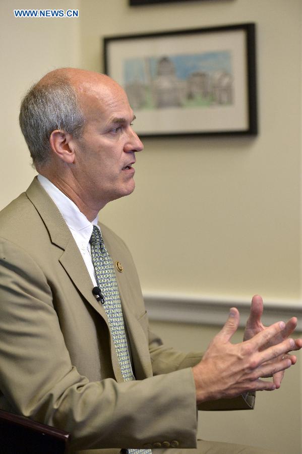 U.S. Congressman Rick Larsen speaks during an interview with Xinhua News Agency on Capitol Hill in Washington, D.C., the United States, Sept. 18, 2015. 